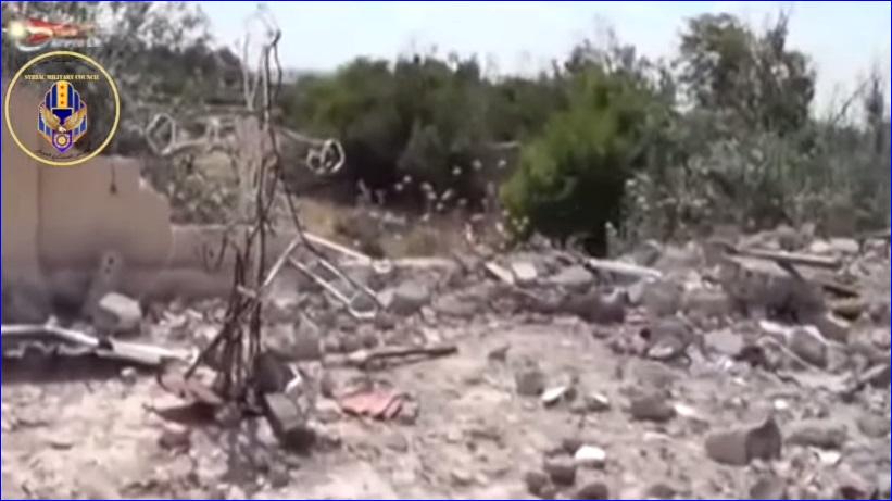 The cross of the Mar Bishu Church in the Assyrian village of Tel Shamiram, Syria, remains standing, but the church was completely leveled by ISIS (screen capture).