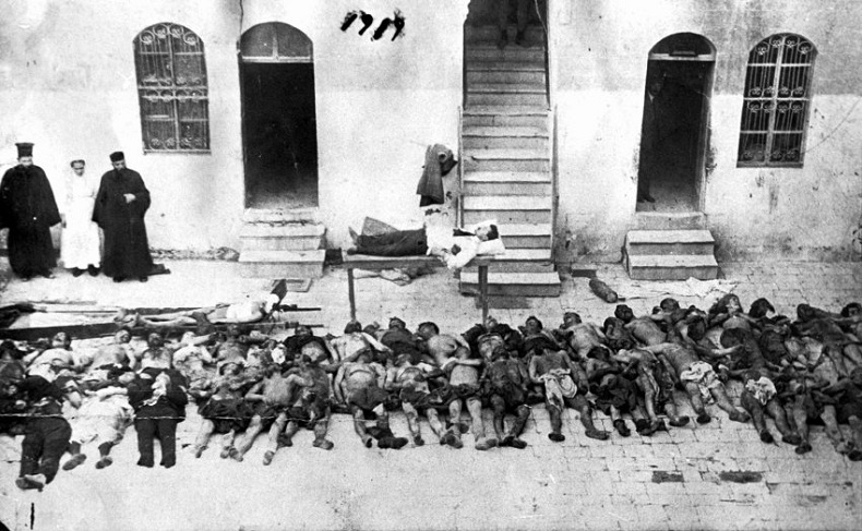 In this 1919 photo released by the Armenian National Archives shows victims of the "Great Slaughter" in the northern Syrian city of Aleppo.  The sign reads: Some of the Armenians, who were killed and brought to the Armenian Relief Hospital during the massacre of Feb. 28th  1919 at Aleppo. Violence against Armenian centers in eastern regions of the dying Ottoman Empire spiked over the summer 1915. Hundreds of thousands of Armenians deemed subversive to the empire _ as many as 1.5 million, by many accounts _ died in what is today eastern Turkey.Most were driven into the deserts of Syria and Iran, over the mountains into the southern Caucasus, into disease and starvation, hounded and attacked by maurauding soldiers, Turkish and others.(AP Photo/Armenian National Archives, HO)